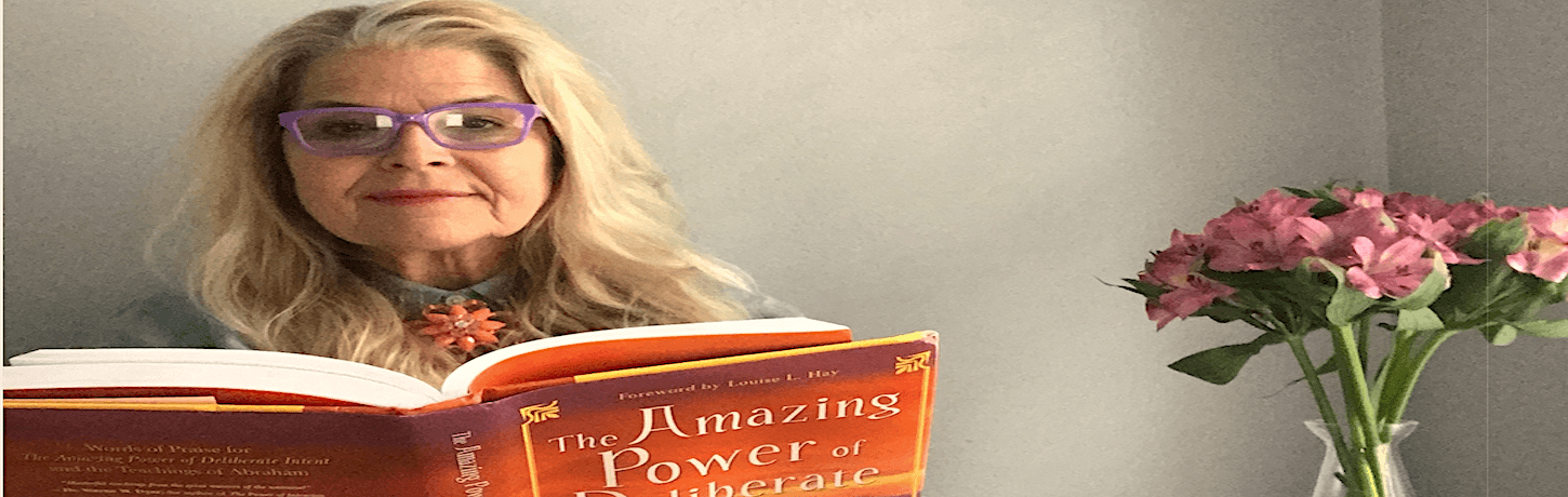 alt="Nina Zapala Reading a Self-Help Book."