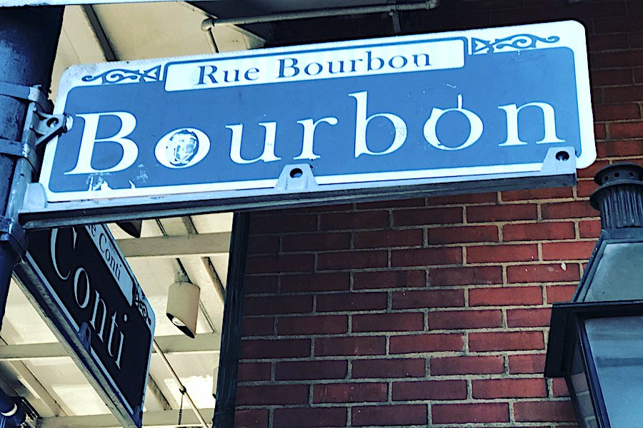 alt="Rue Bourbon Street Sign New Orleans."