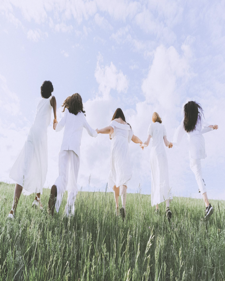 alt="Women with different spiritual personality types expressing joy in nature"