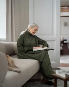 alt="Women Journaling On Her New Beginning."